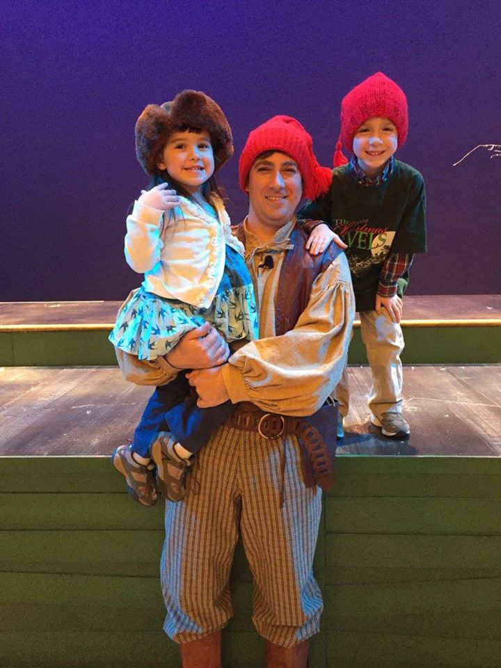 Chris Lewis with his children after a 2017 French-Canadian Christmas Revels performance.